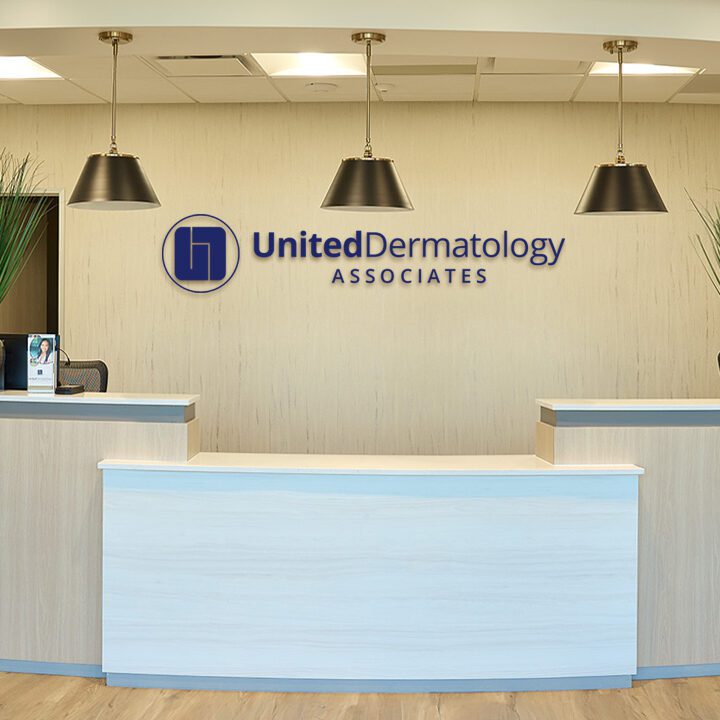 United Dermatology medical office interior reception desk construction project by Ren Pro General Contracting in Texas