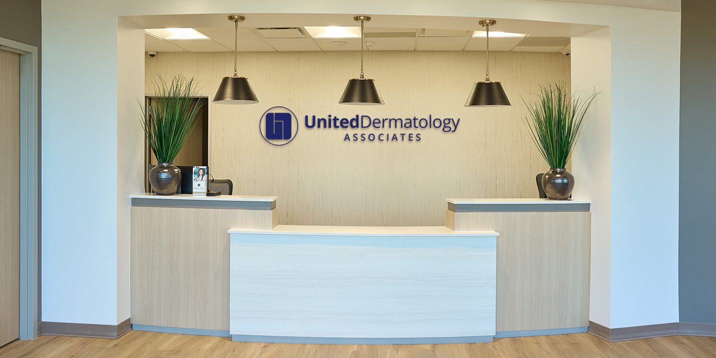 United Dermatology medical office interior reception desk construction project by Ren Pro General Contracting in Texas